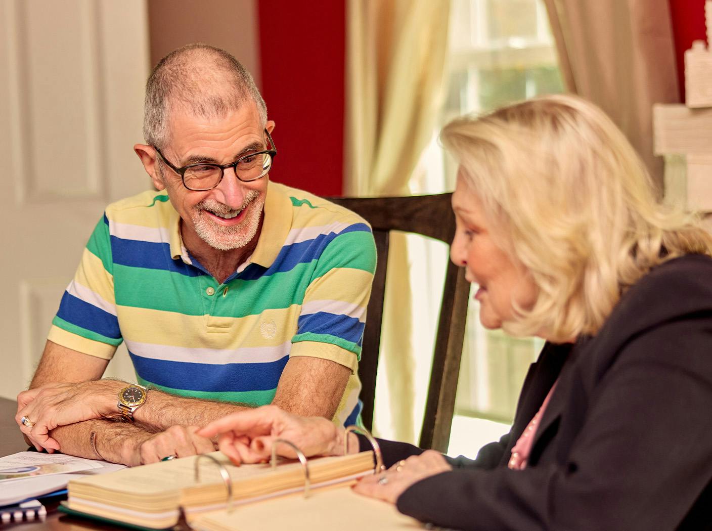 woman explaining forms to male client