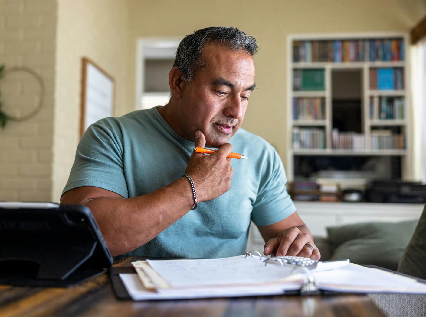 man filling out paperwork