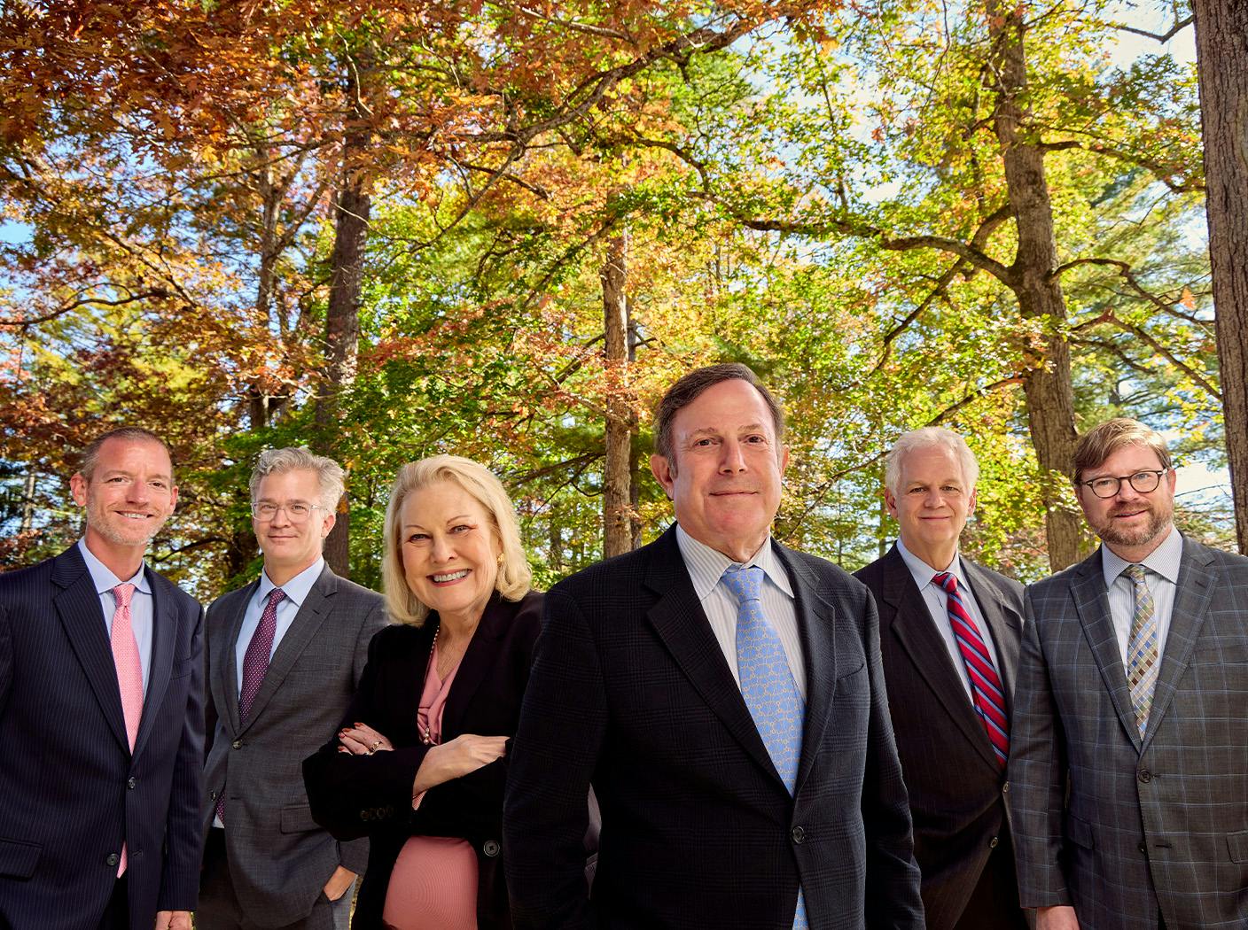 Strauss Law staff photo together in suits