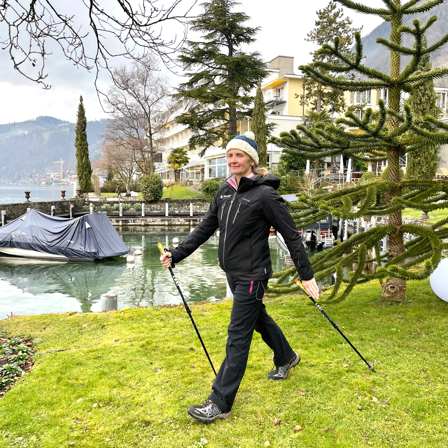 Nordic walking at the Hotel Beatus Woman practising Nordic Walking in the park