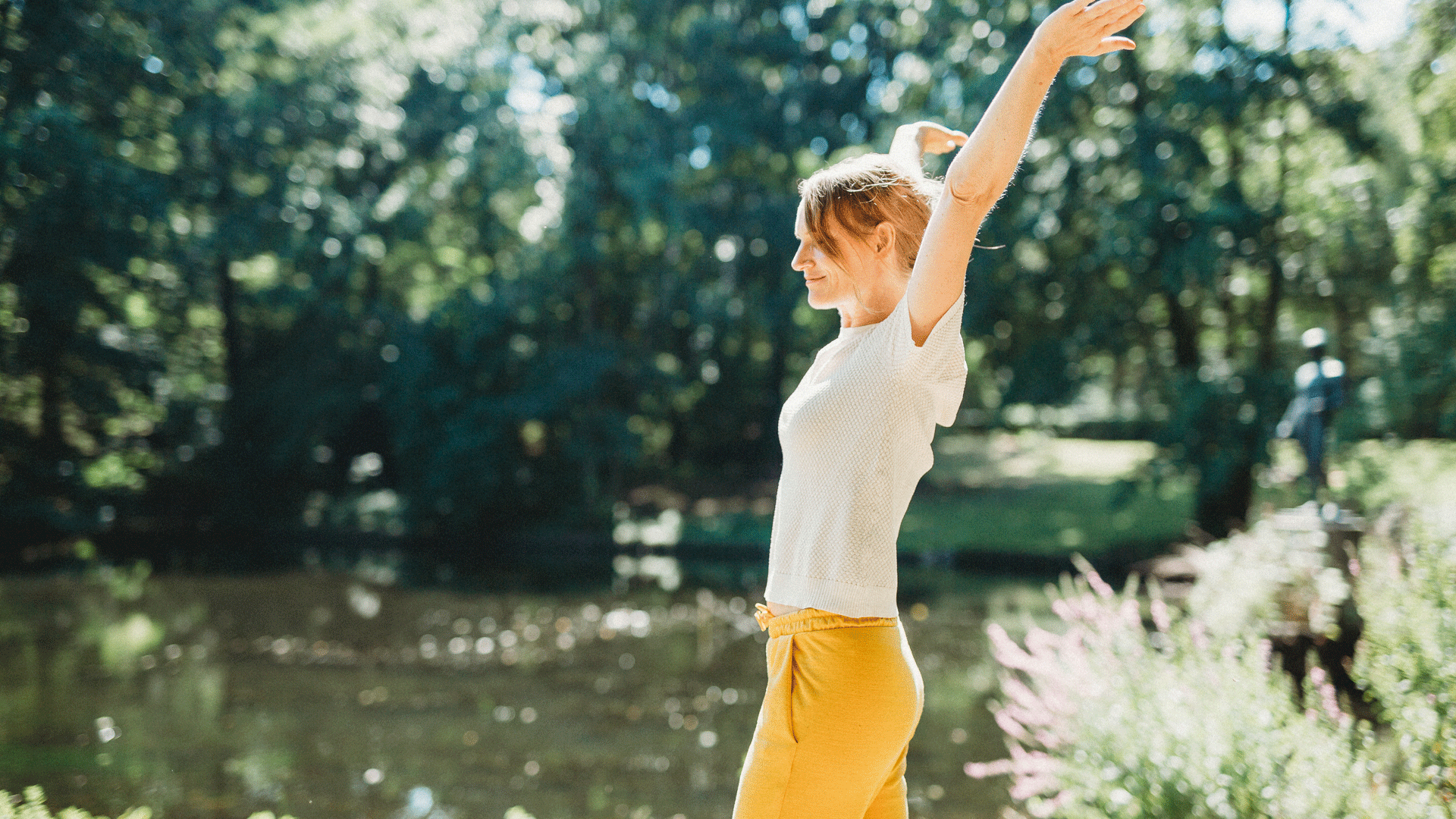 Selfcare Retreat Young woman in the green with outstretched arms