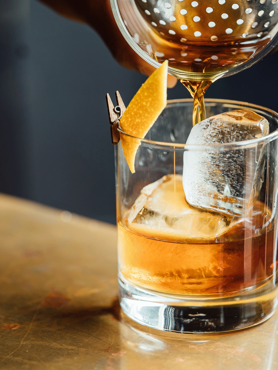 Drink Drink with ice cubes and orange zest