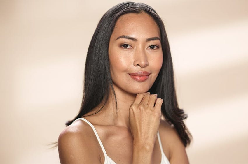 woman with her hand under her chin