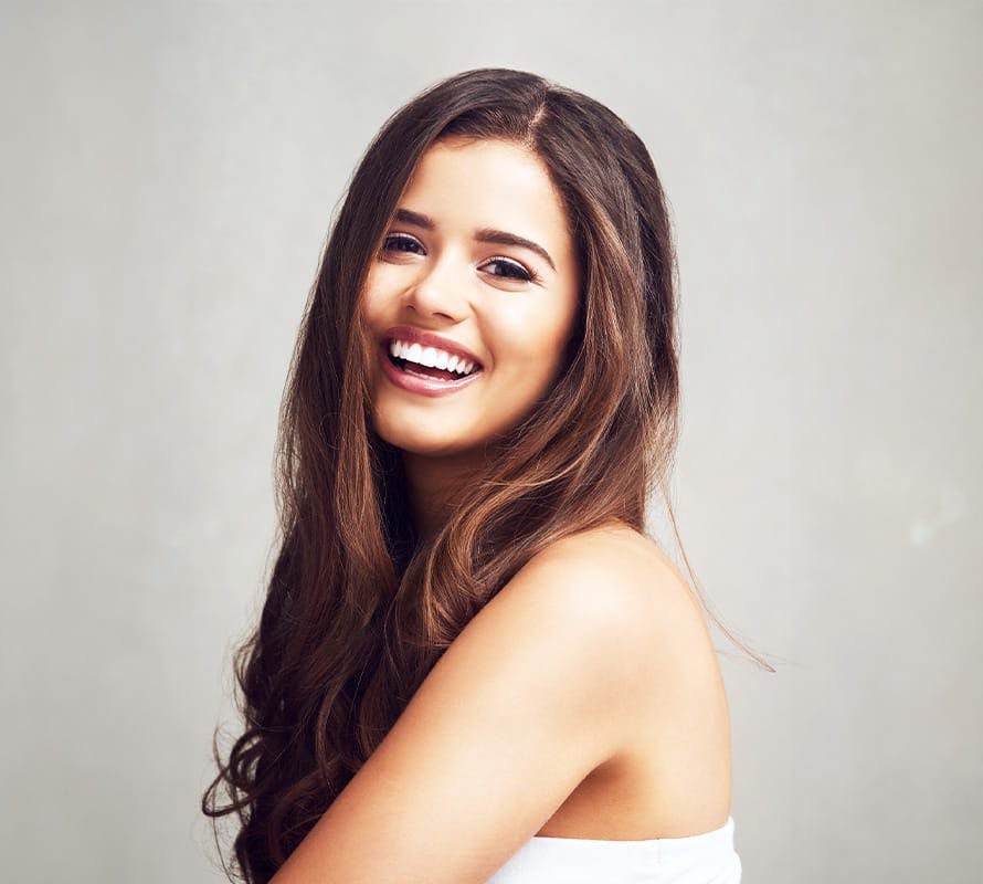 woman with long brown hair smiling