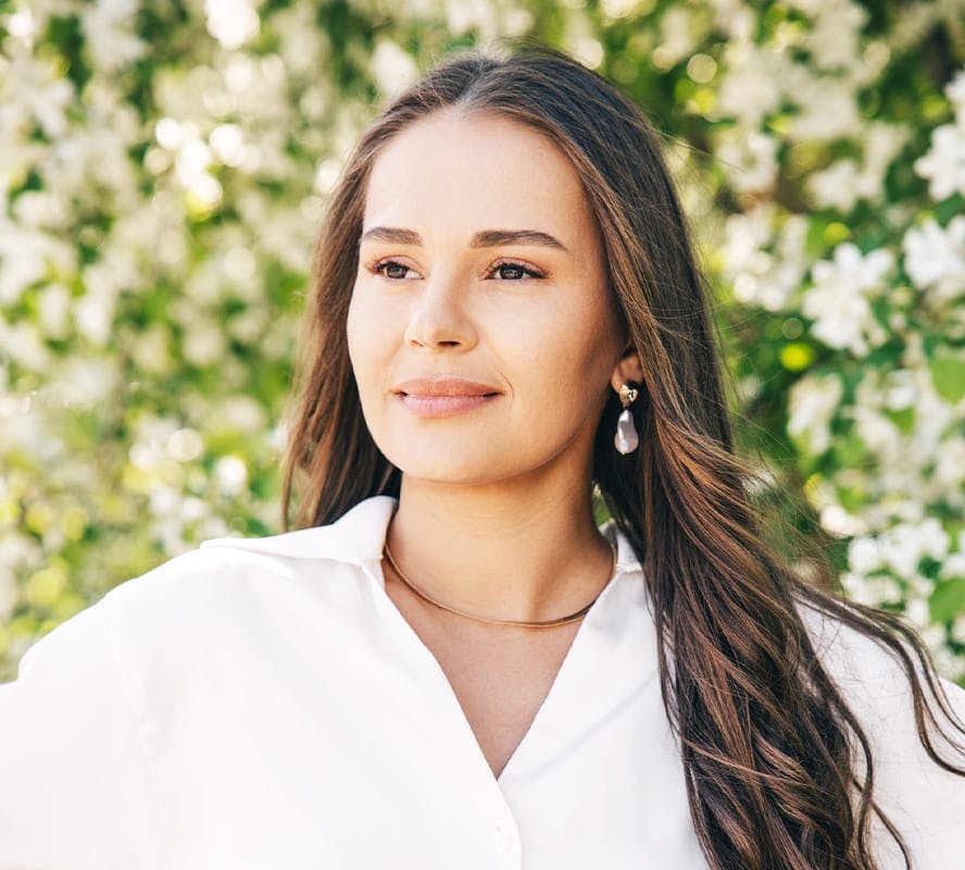 woman outside in white shirt