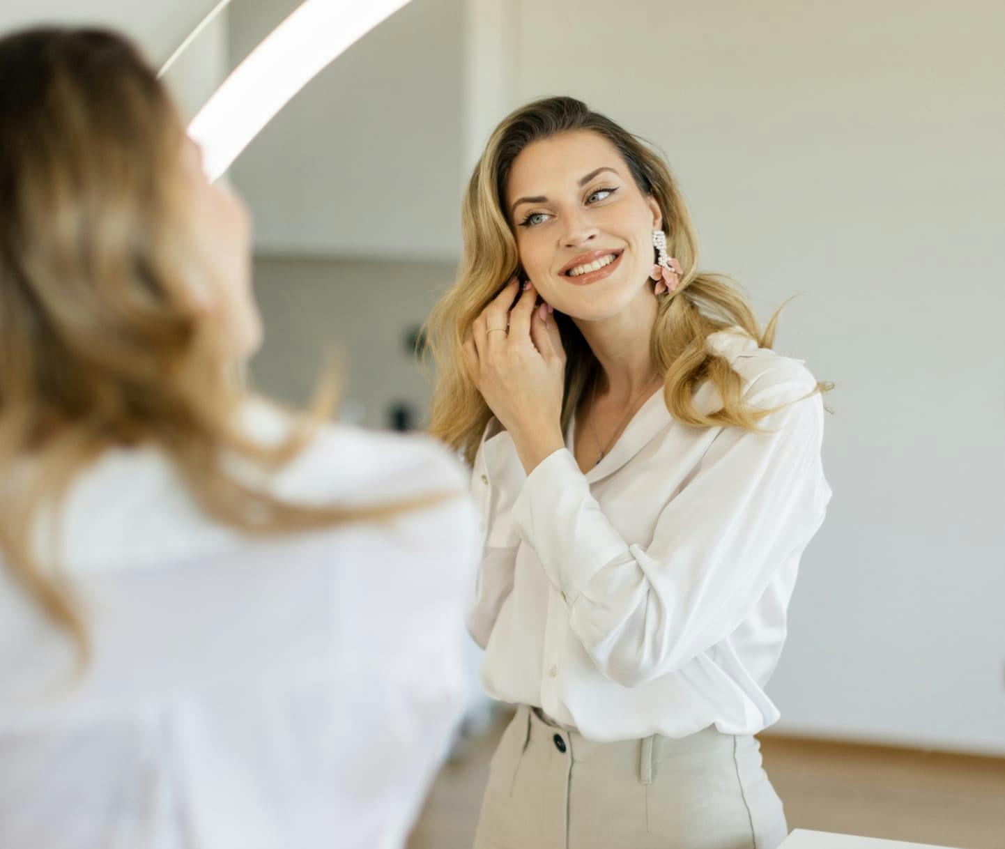 Woman smiling in the mirror