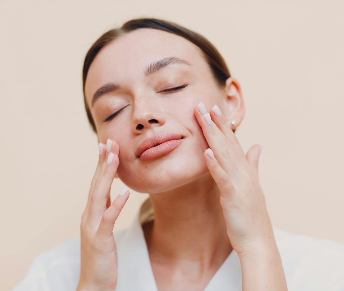woman touching her face