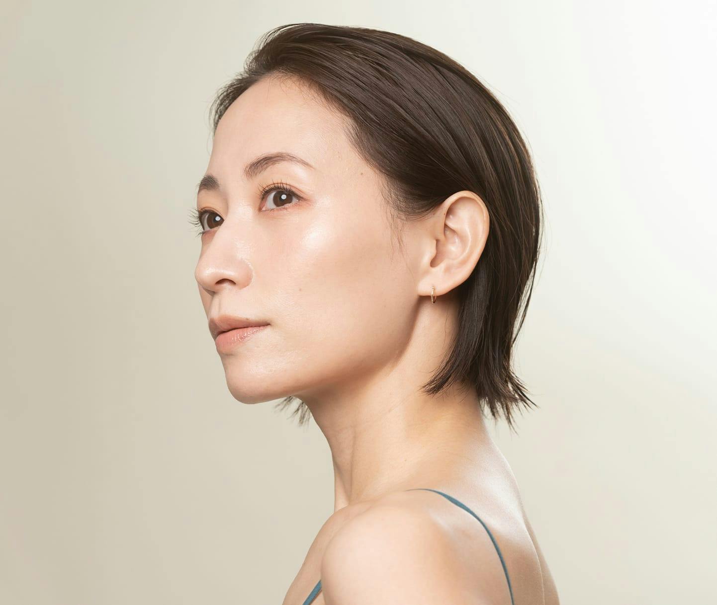 woman with short hair looking out