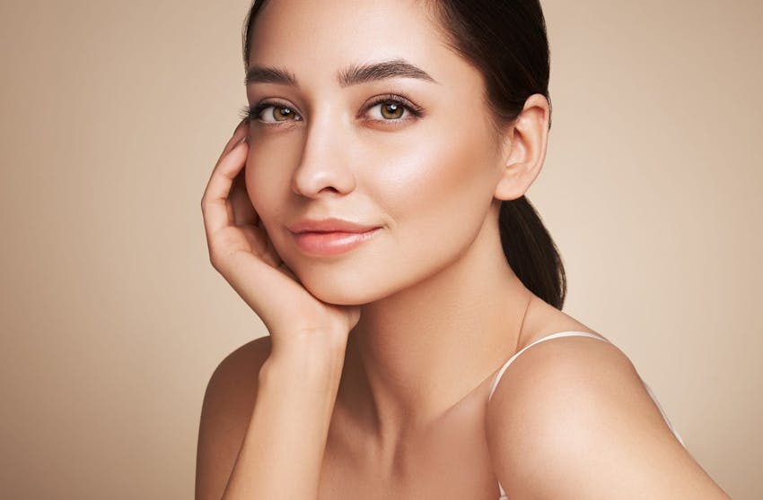 woman resting her head in her hand