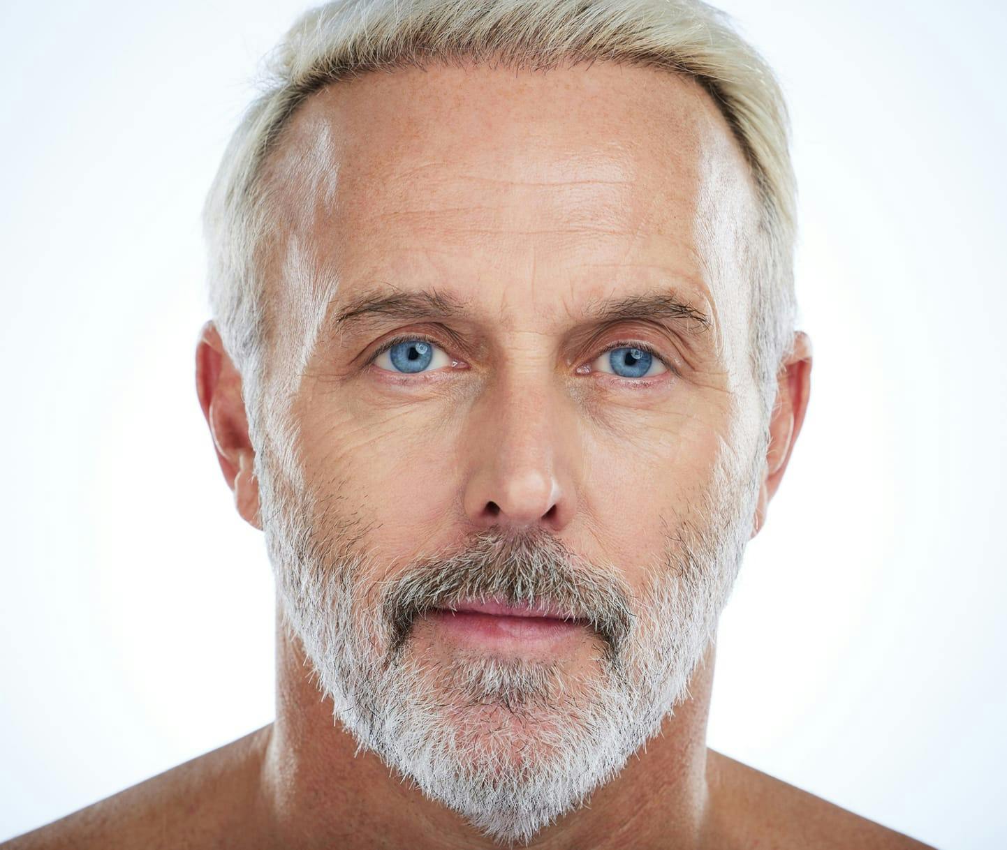 older man looking into the camera