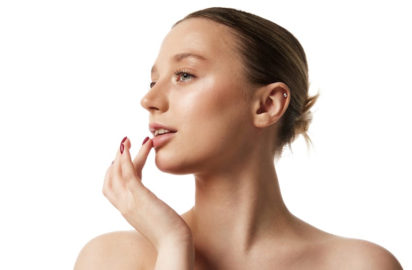 woman touching her lips