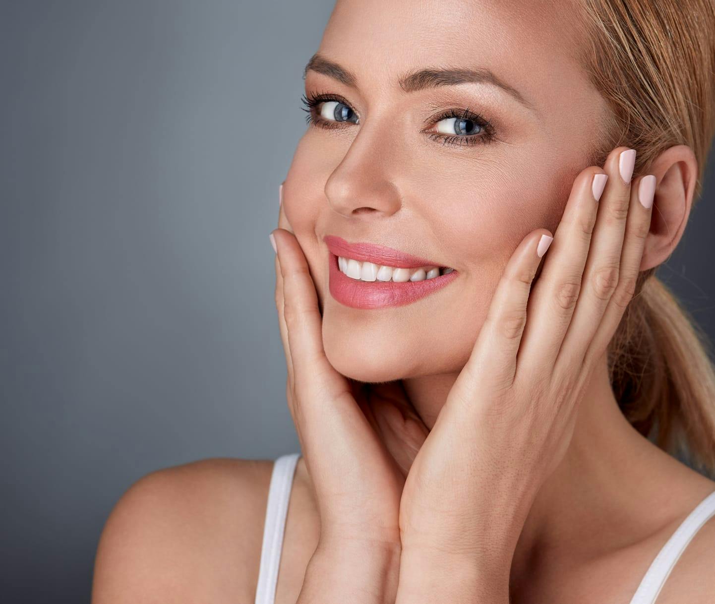 woman touching the sides of her face