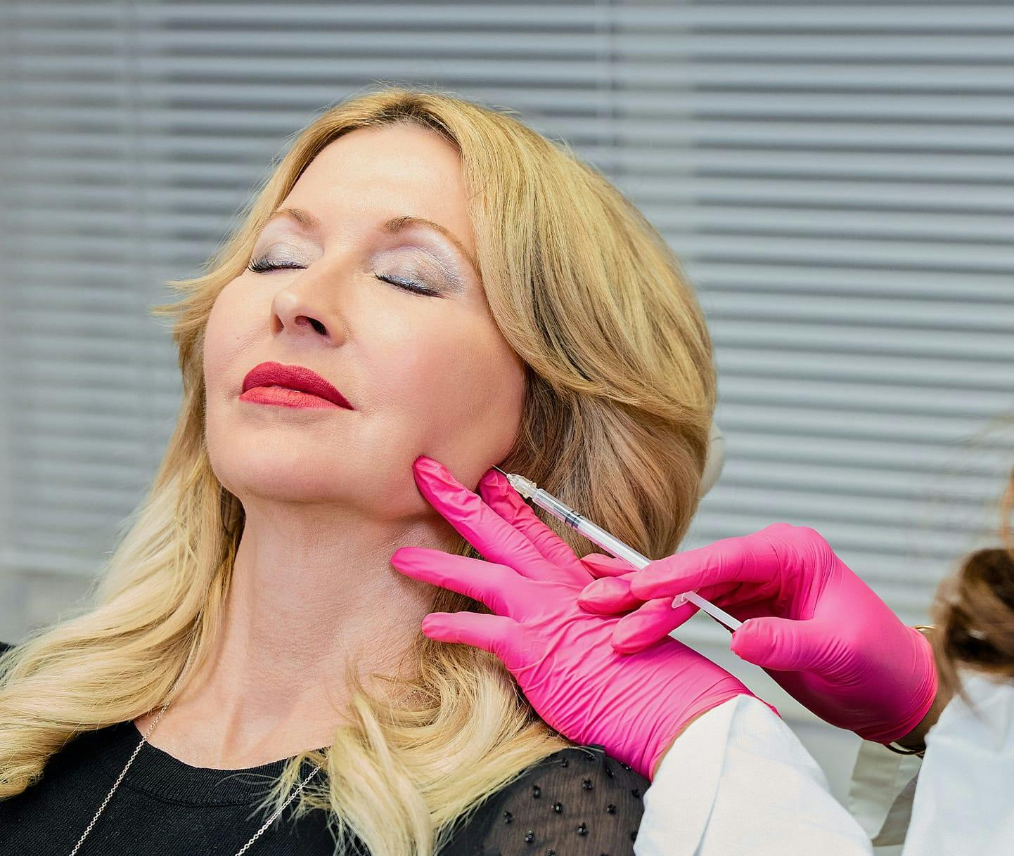 woman getting cheek fillers