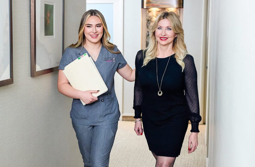 patient walking with staff member in hallway