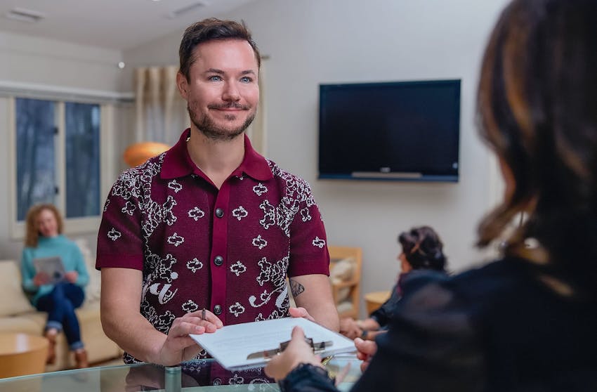 man holding paperwork