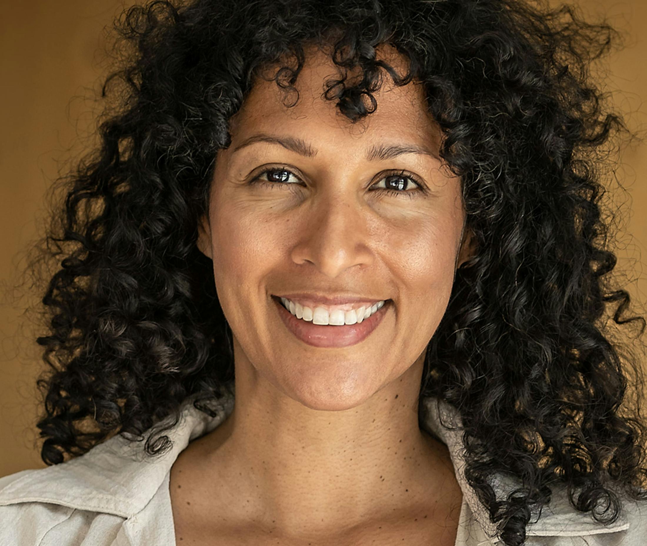 Woman looking down towards shoulder