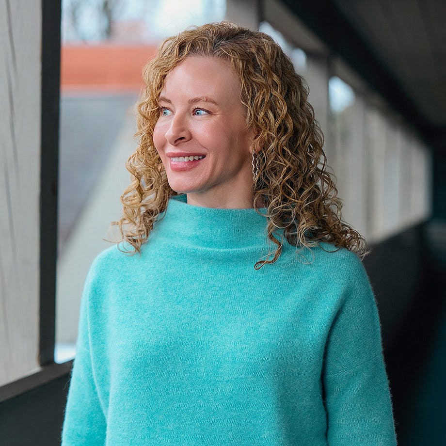 woman in a teal sweater