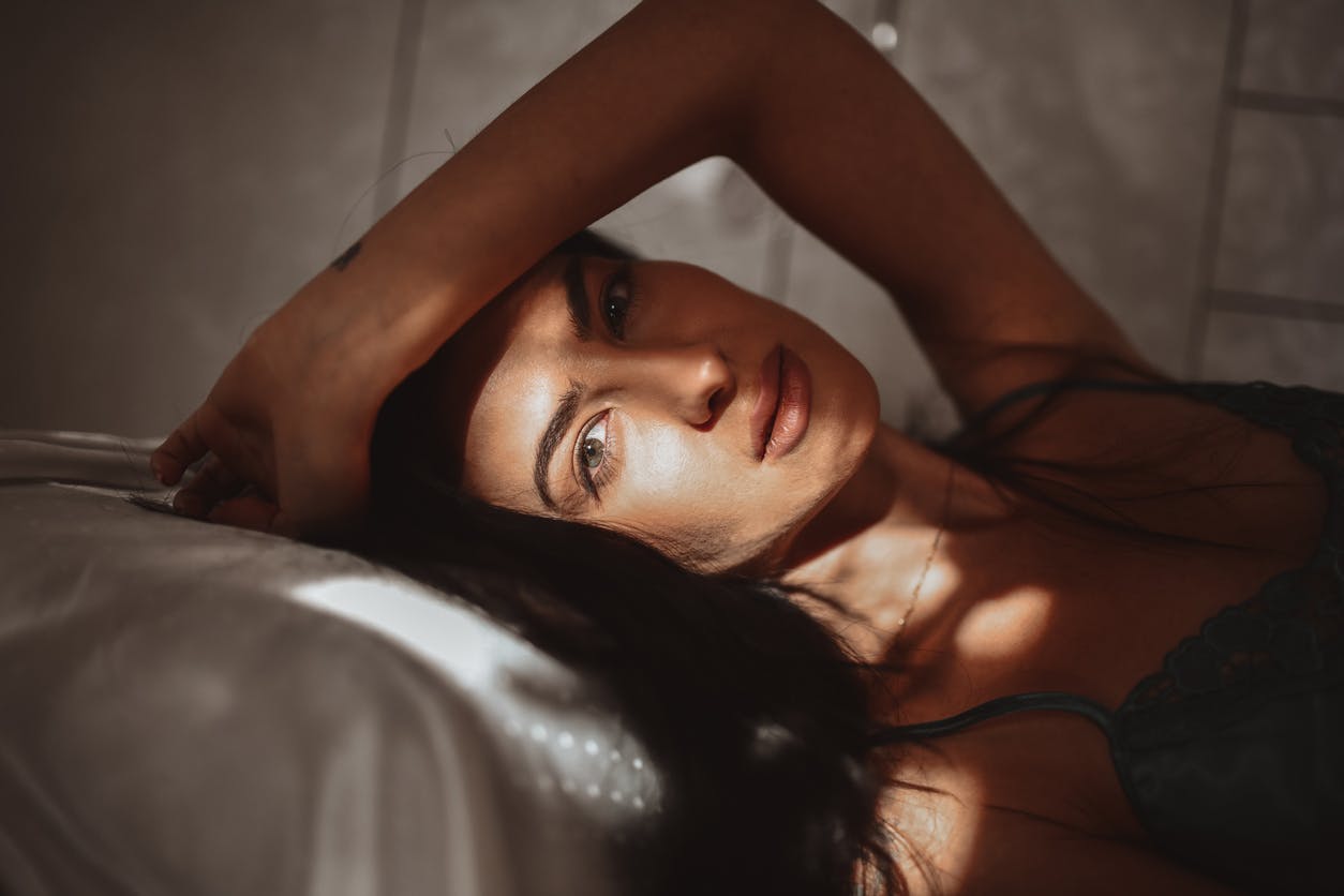 Woman lying down looking at camera