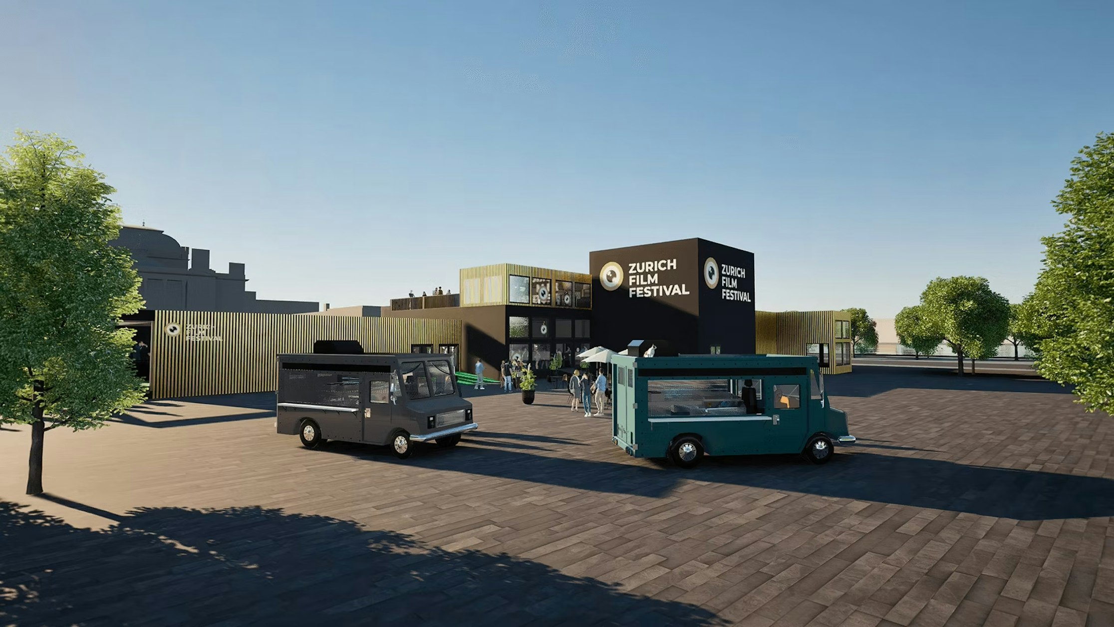 Zwei Food Trucks parken auf einem Platz vor einem modernen Gebäude mit dem Schild des Zurich Film Festival. Mehrere Menschen stehen in der Nähe unter einem strahlend blauen Himmel, der Platz ist von Bäumen gesäumt.