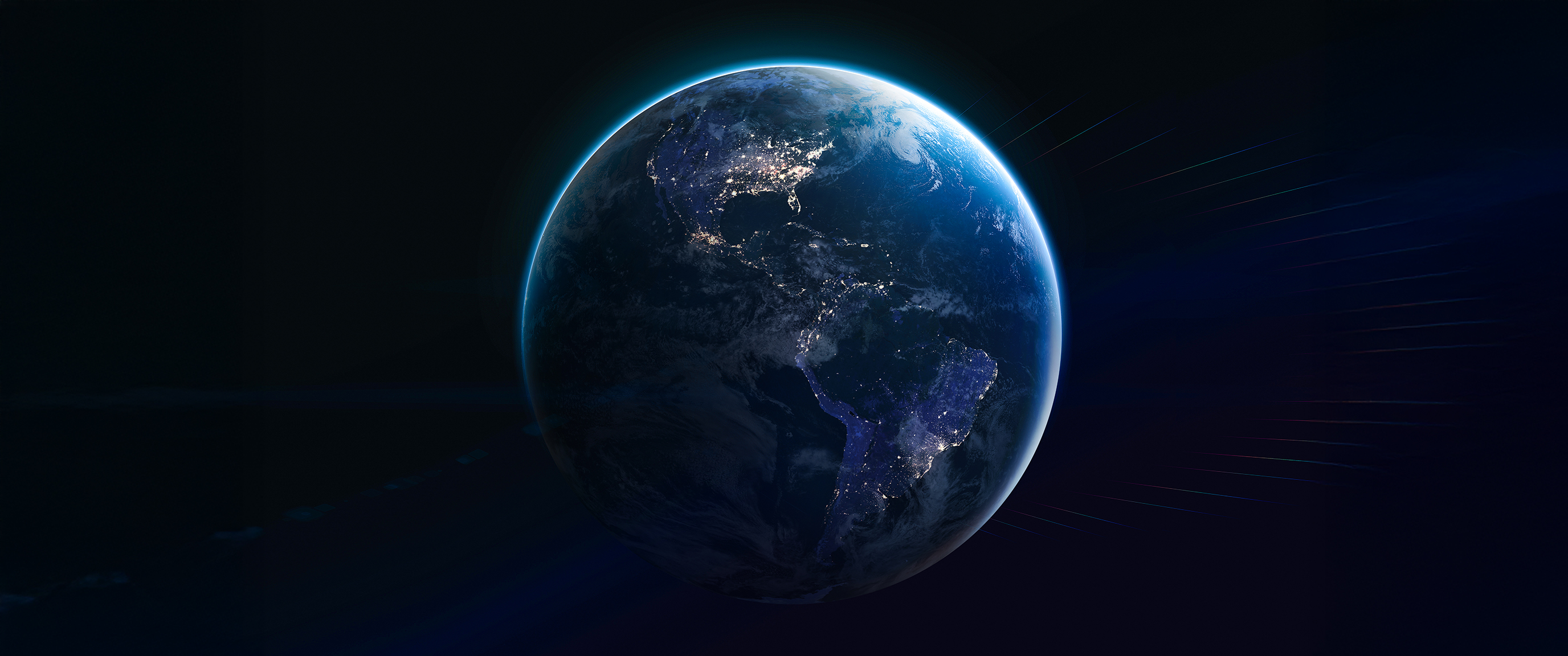 Earth viewed from space at night with illuminated cities.