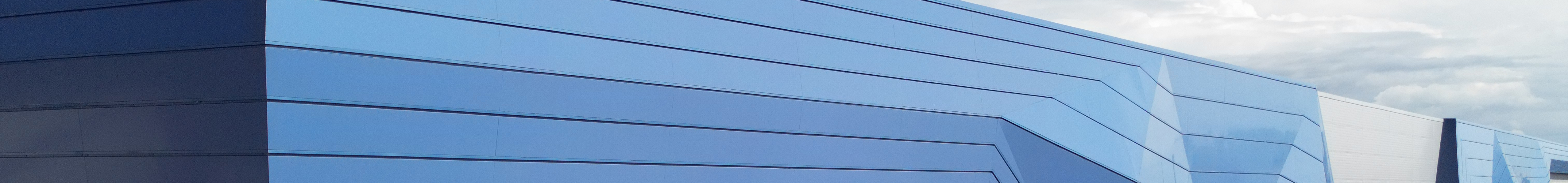 Modern industrial building with blue exterior panels
