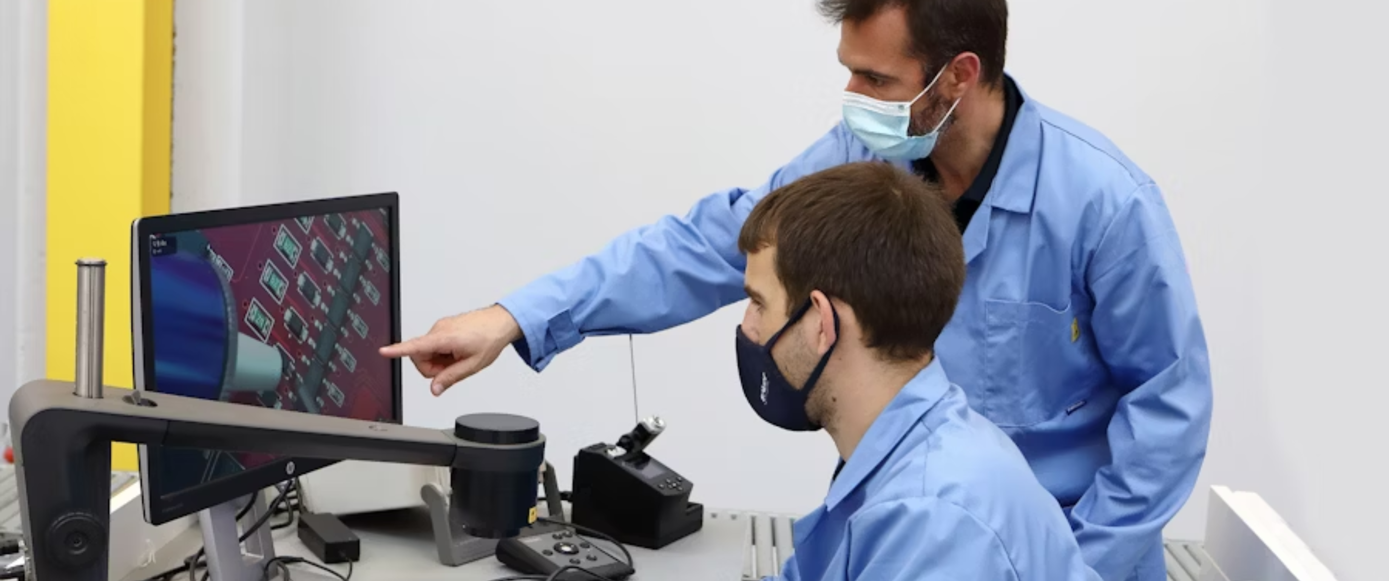 Scientists working in a modern laboratory with analytical equipment.