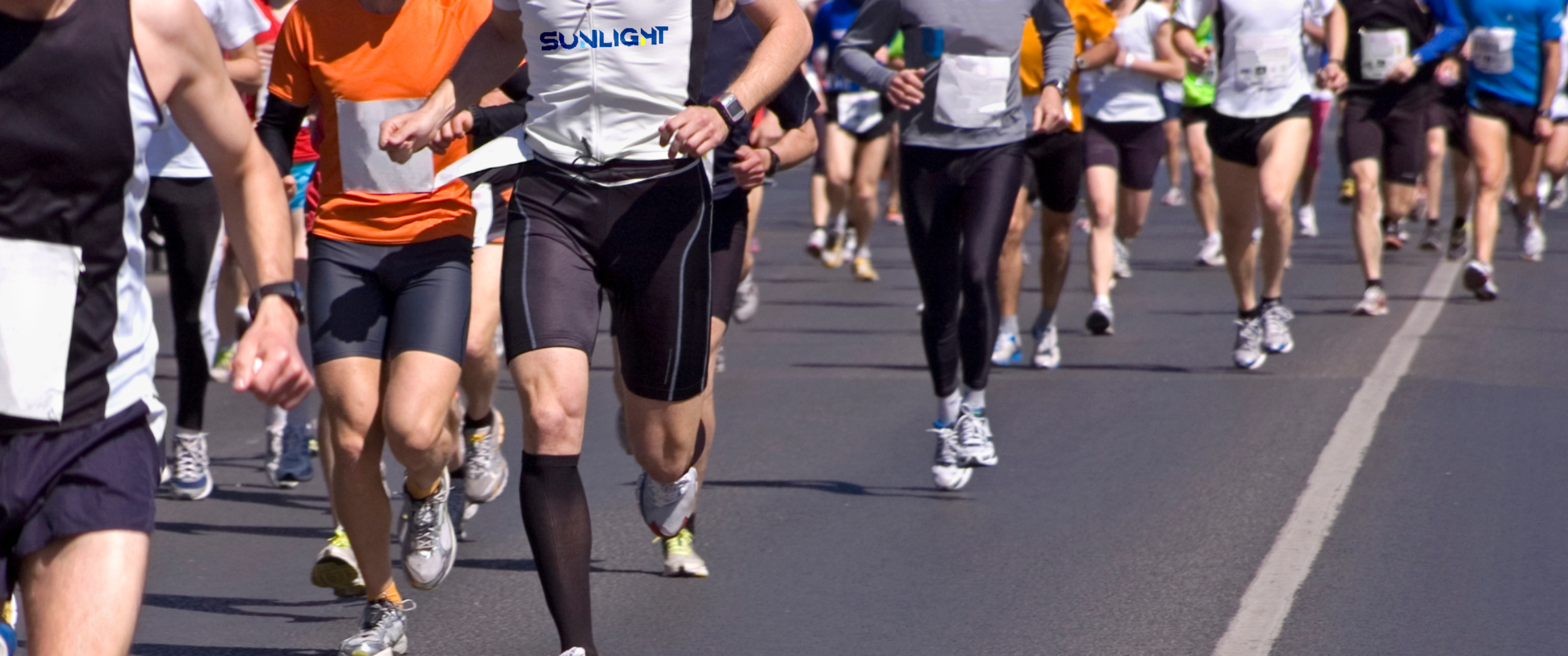 Group of runners in a road race, representing Sunlight Group community engagement and corporate event