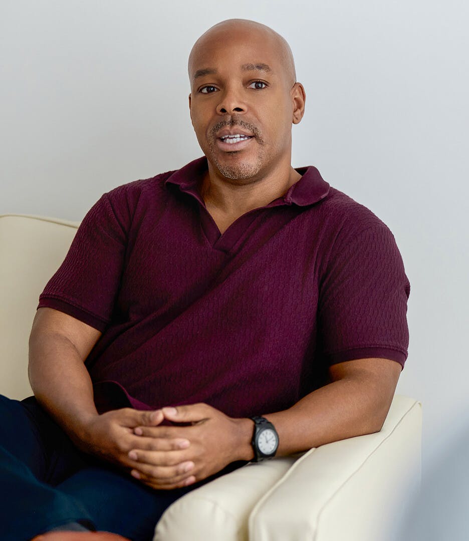 Man leaning on a couch