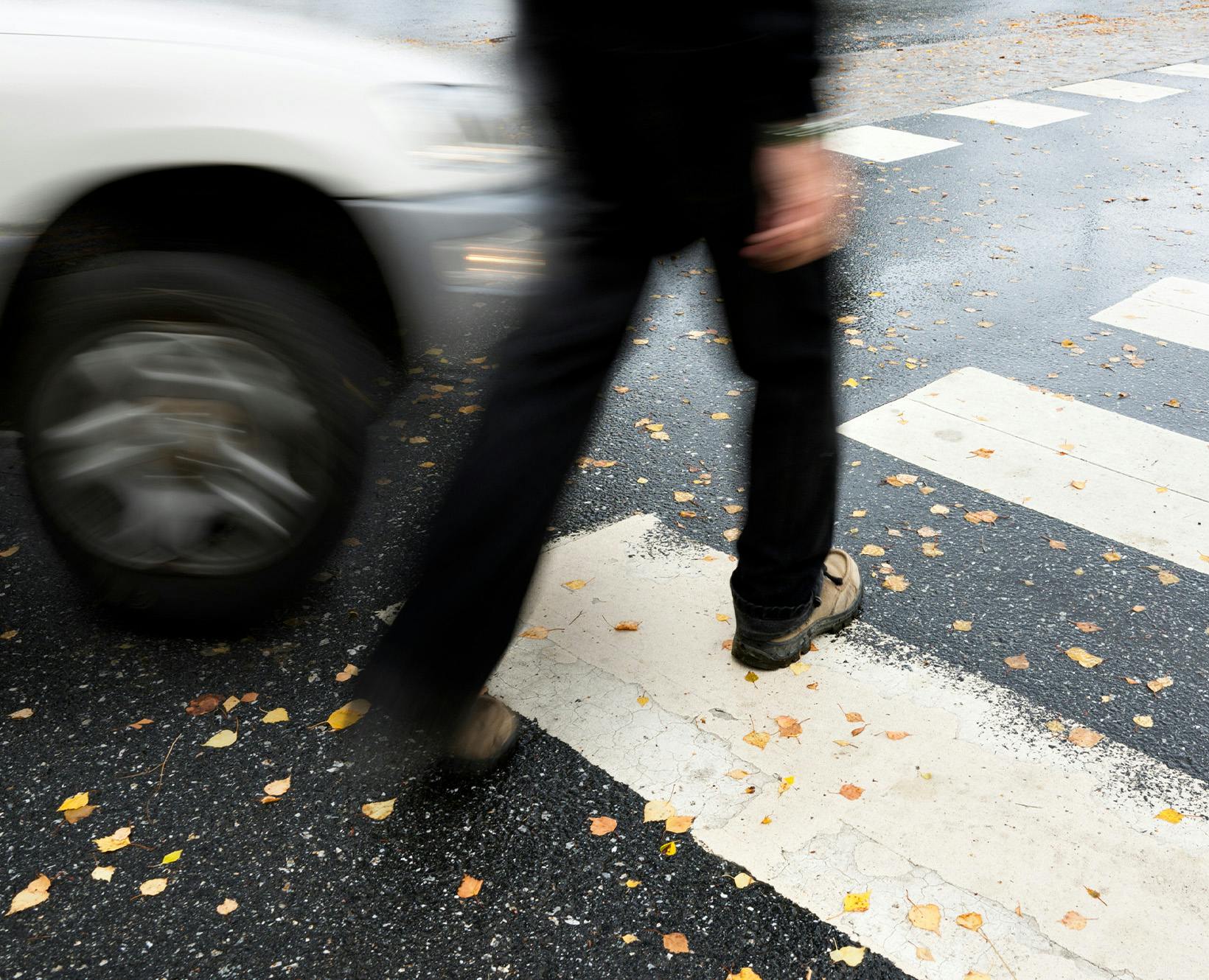 Person walking about to get hit by a car