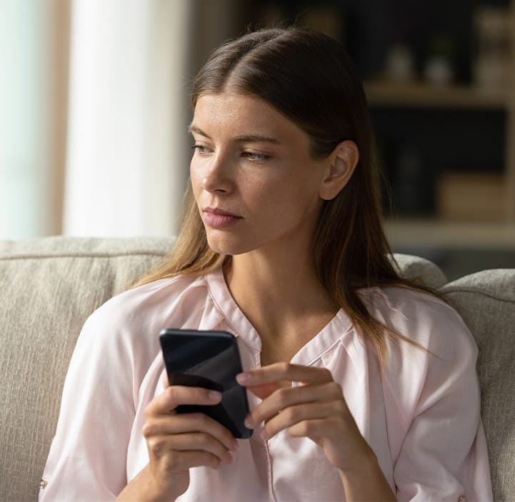 woman holding her phone