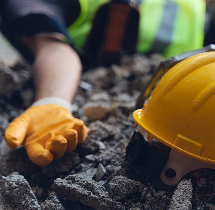 cunstruction worker laying on the ground