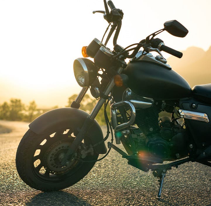 motorcycle sitting on the side of the road