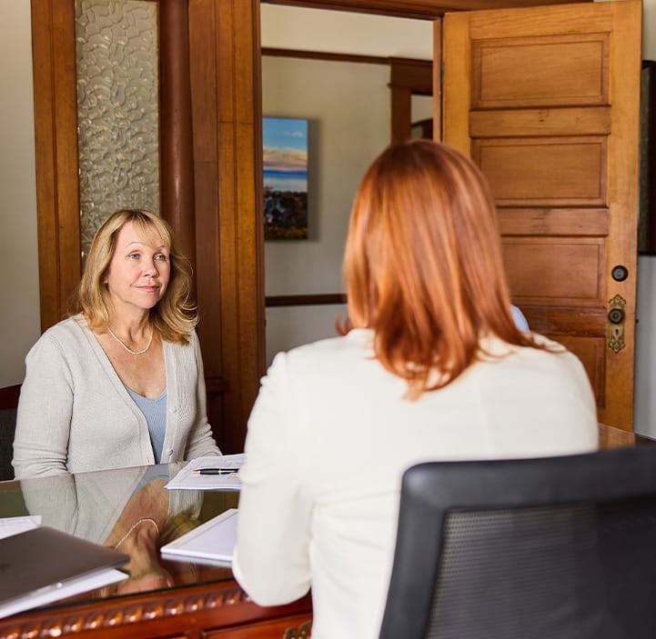 woman speaking to another woman