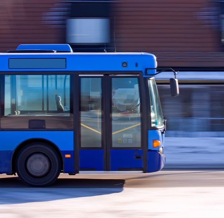 bus driving on a road