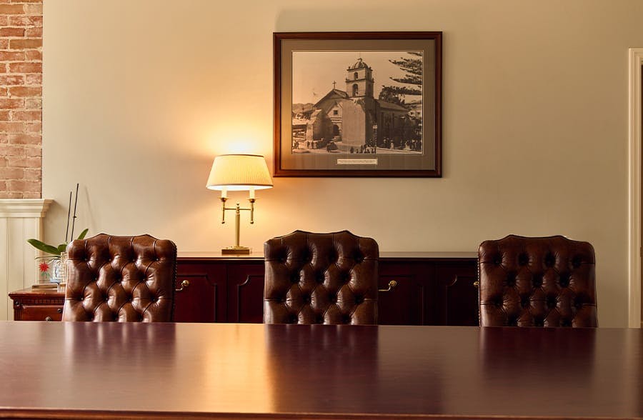 three chairs againsts a table