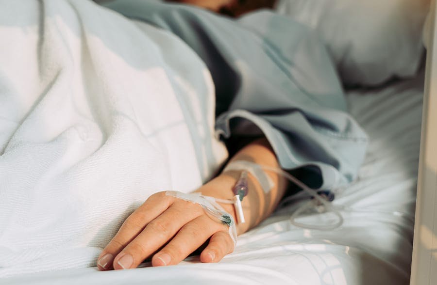 person laying in a hospital bed