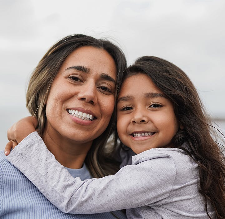 little girl hugging her mom