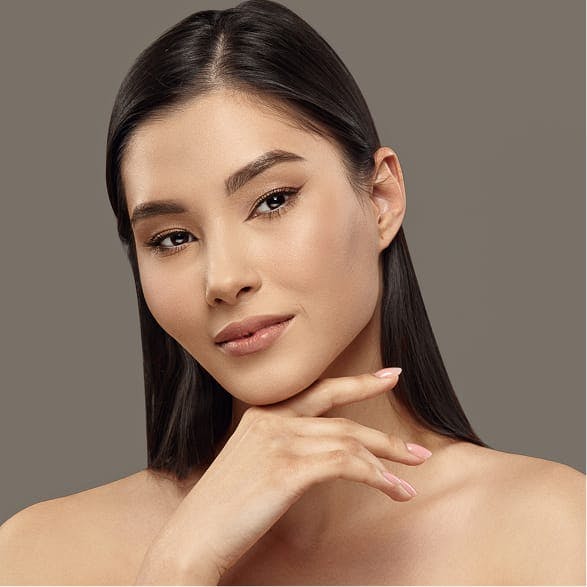 A woman with a hand to her chin