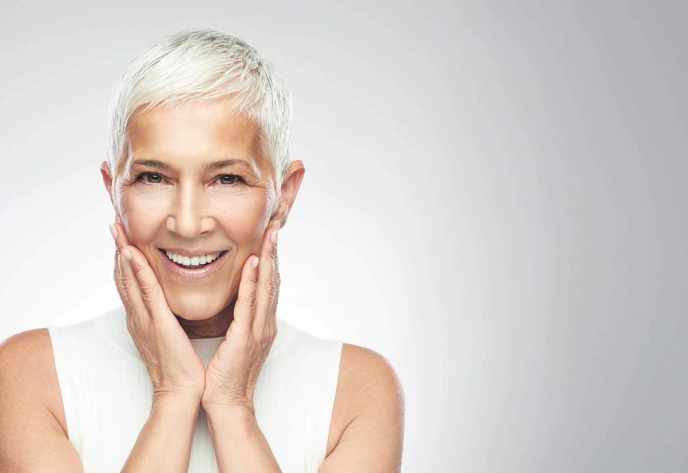 Woman putting her hands to her face