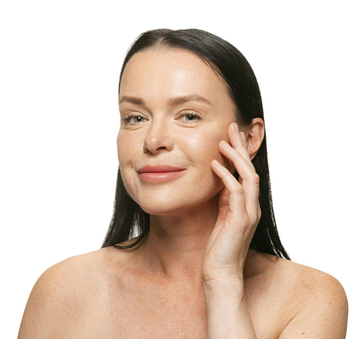 Woman smiling and touching cheek