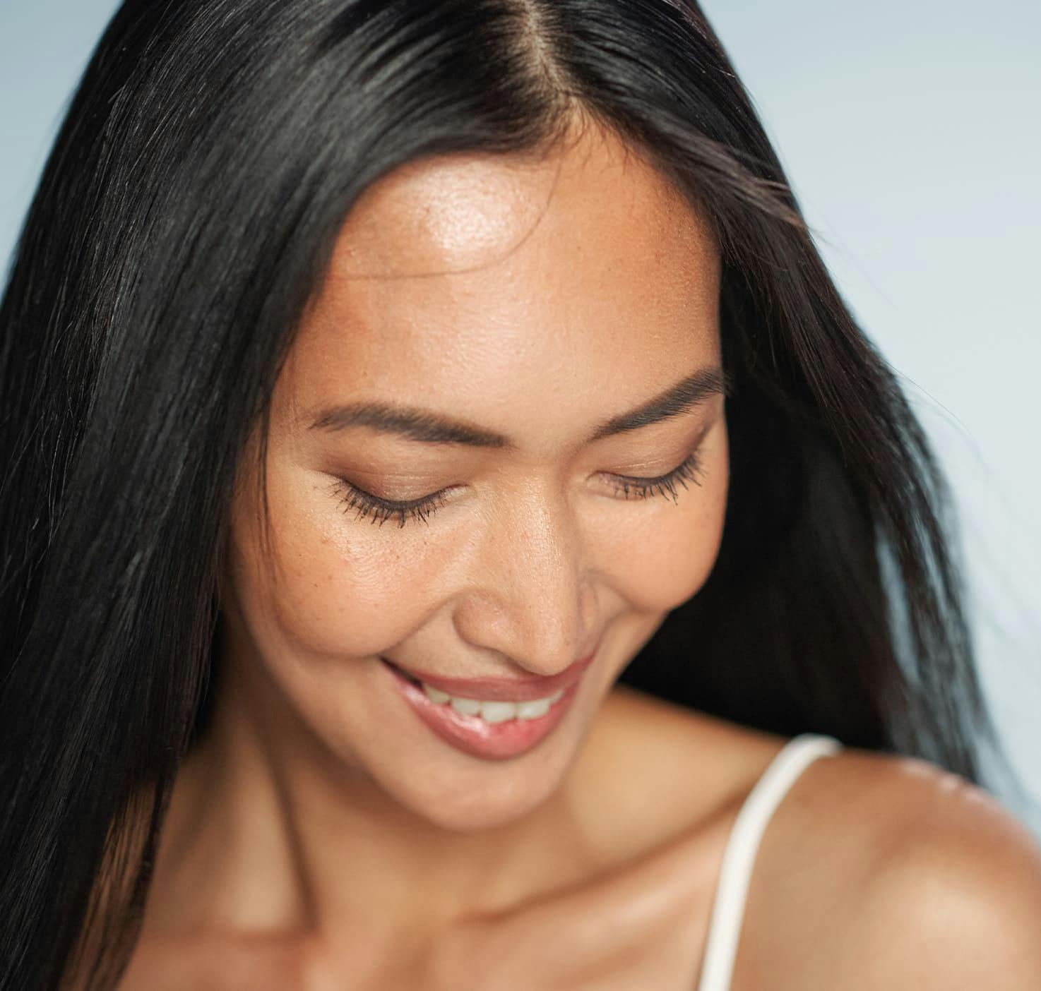 Woman looking down and smiling
