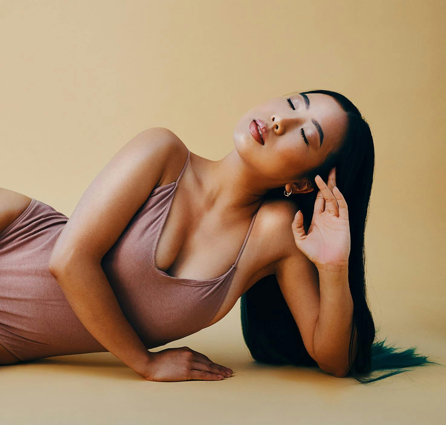 Woman laying on her side on the floor