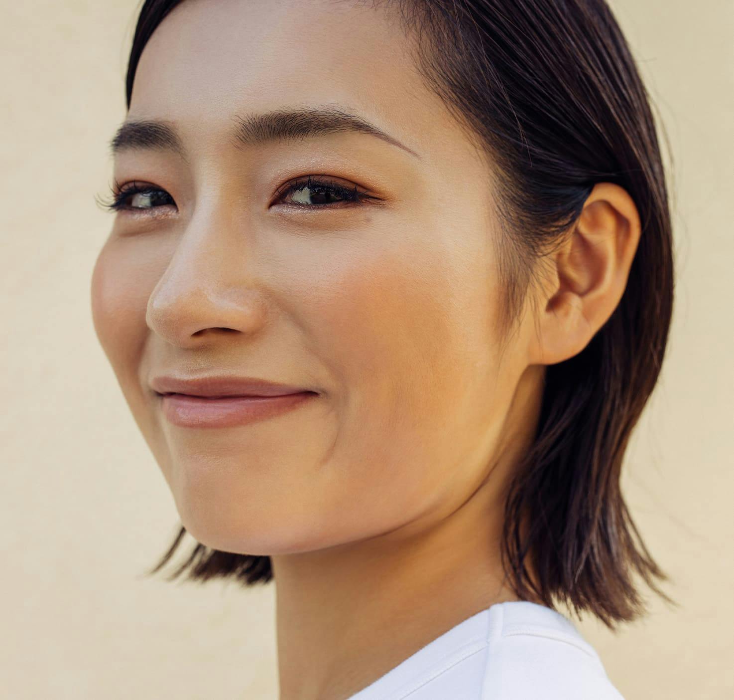 close up of woman with short hair smiling