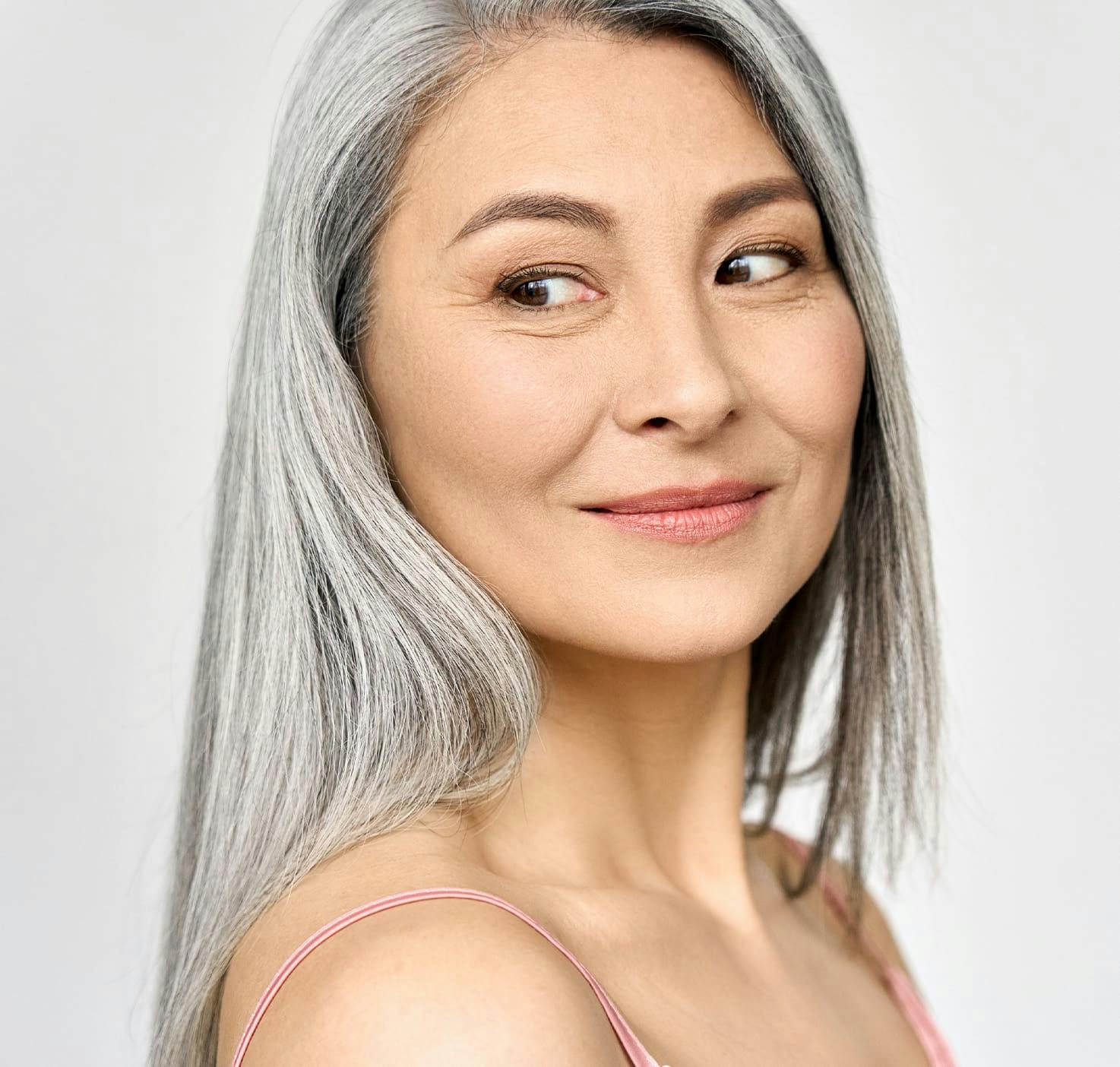 Woman smiling looking over shoulder