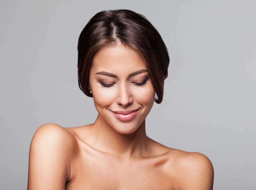 Woman looking down smiling