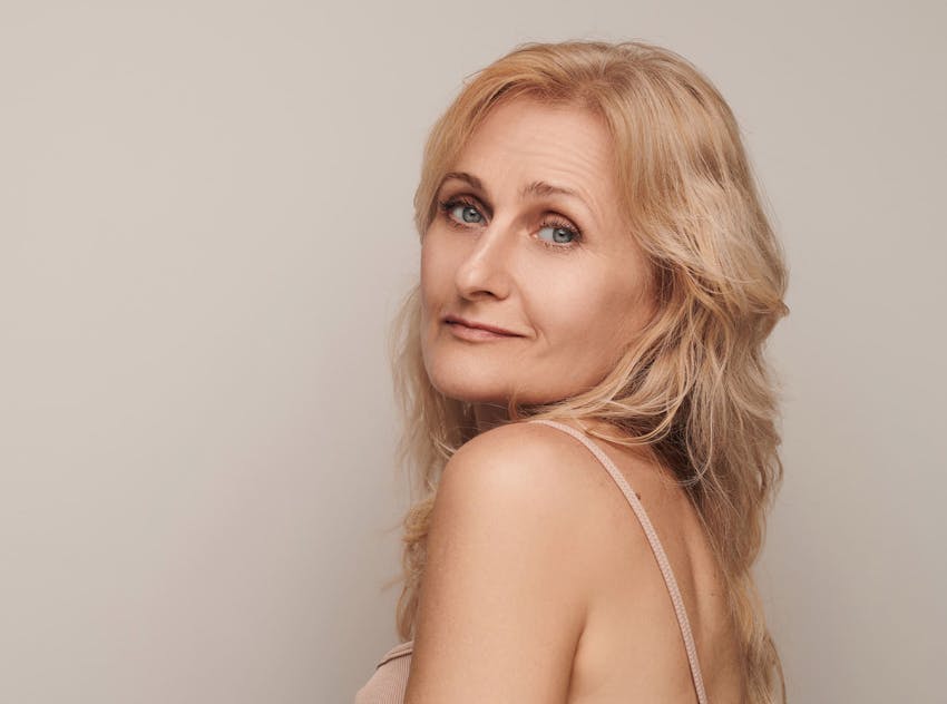 Woman looking over her shoulder