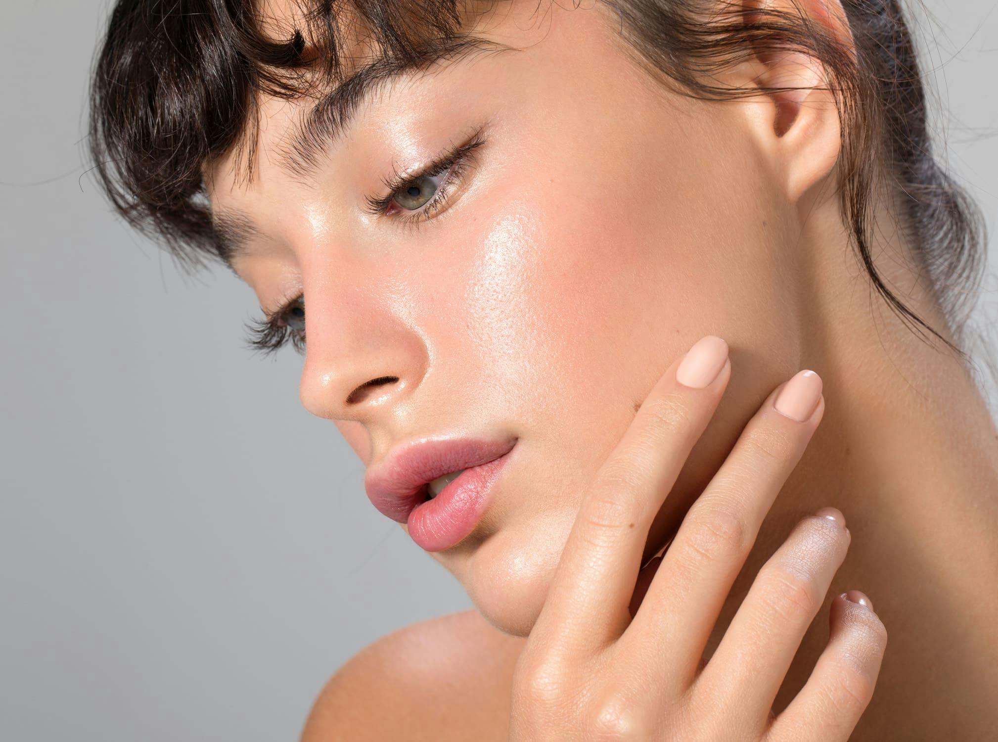 Woman touching face
