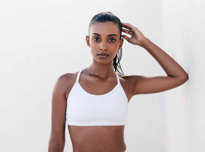 Woman with arm above head