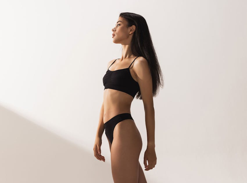 Woman standing and looking up