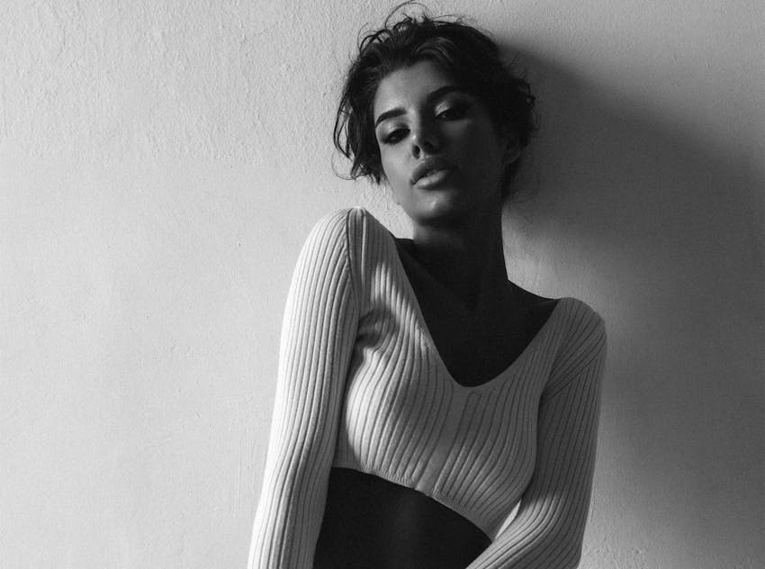 Woman brushing her hair back